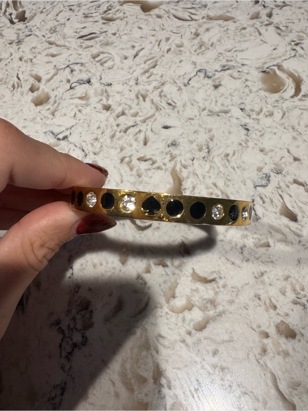 Kate Spade Gold Bangle Bracelet with Black Accent and Clear Stones